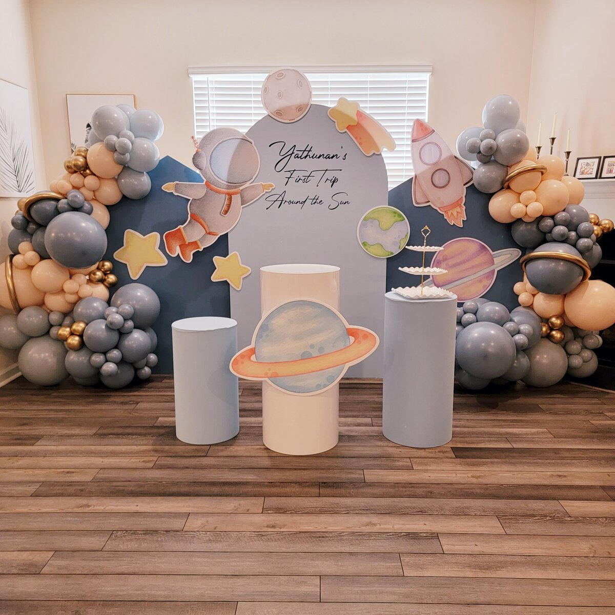 Space-themed balloon backdrop package featuring astronaut decorations for a boy’s party by Air with Flair Decor, Raleigh Balloons and Event Rentals.