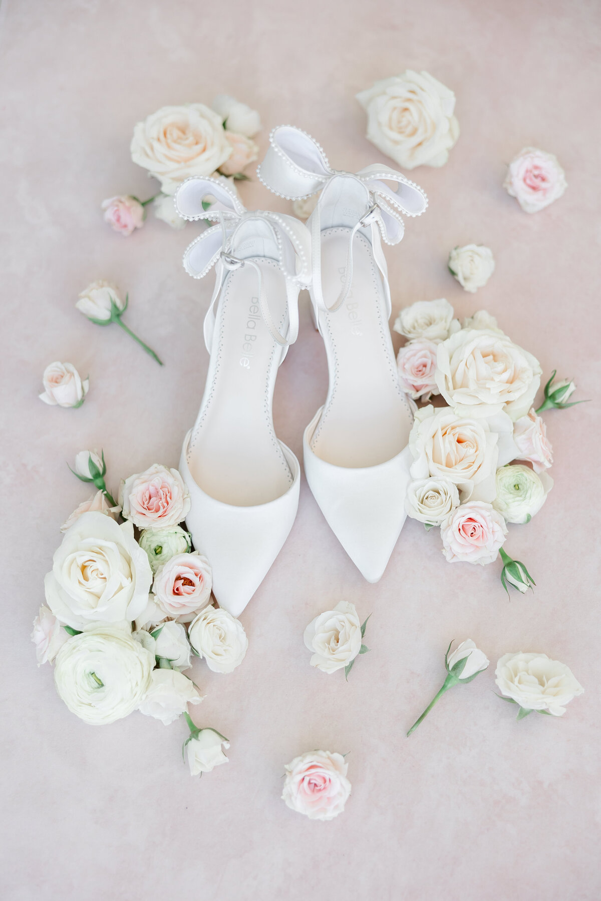 detail photo of wedding shoes with flowers by wedding photographer in florida