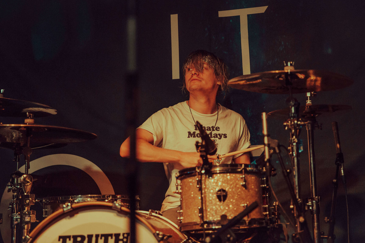 A close up of Maxx Danziger, drummer  of Set It Off onstage at The Garage in London