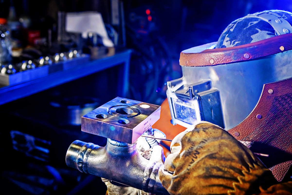 Advertising photograph  of a welder in a machine shop