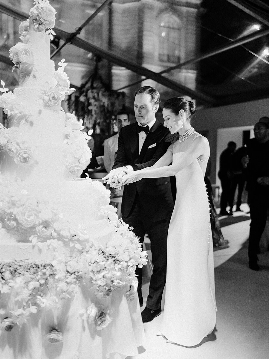 Musee Rodin Wedding by Alejandra Poupel Events B&W bride and groom cutting the cake