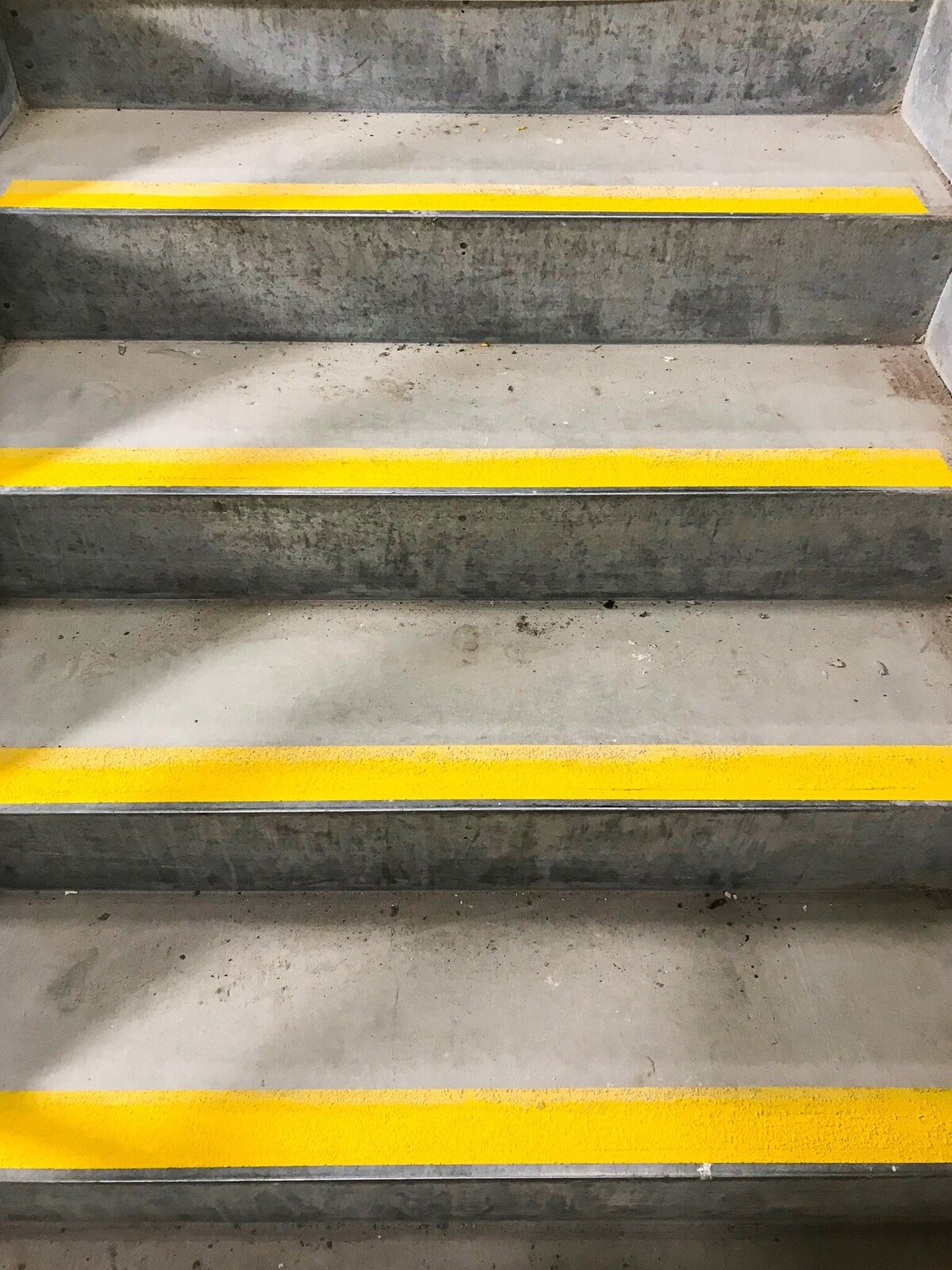 Yellow stair nosing applied to emergency stair wells