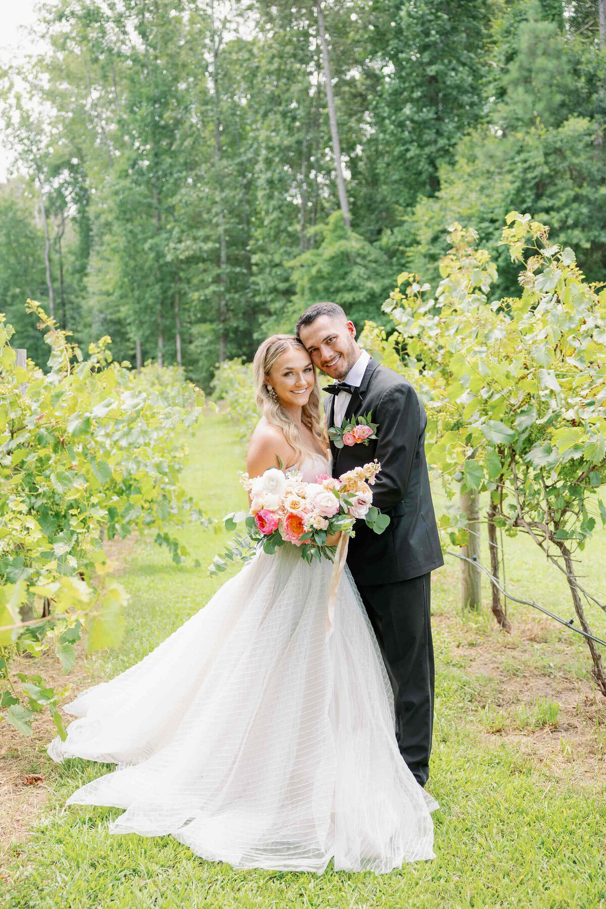bride and groom portraits in the vineyards at koury farms