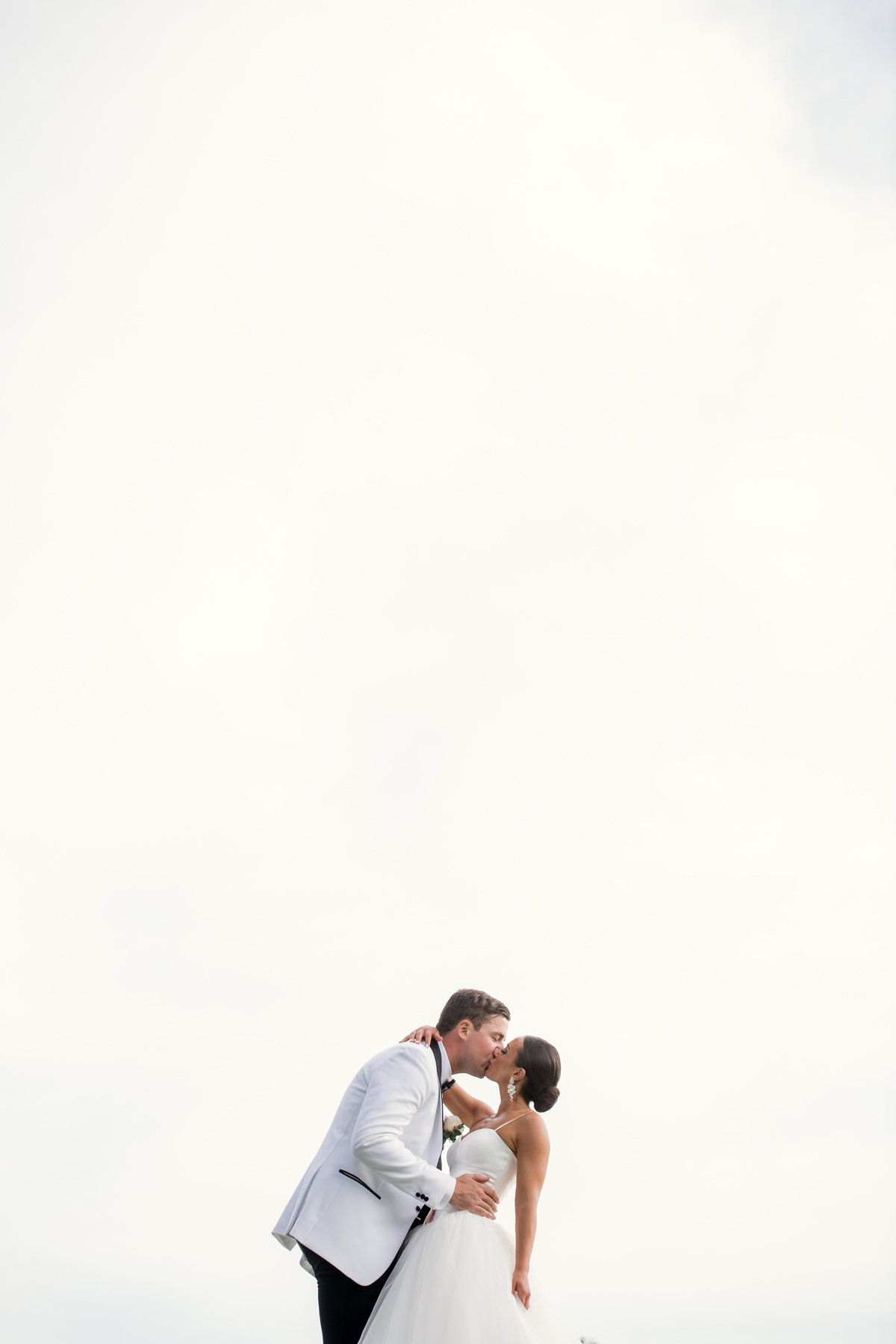 plain white background photo with bride and groom at The Muttontown Club
