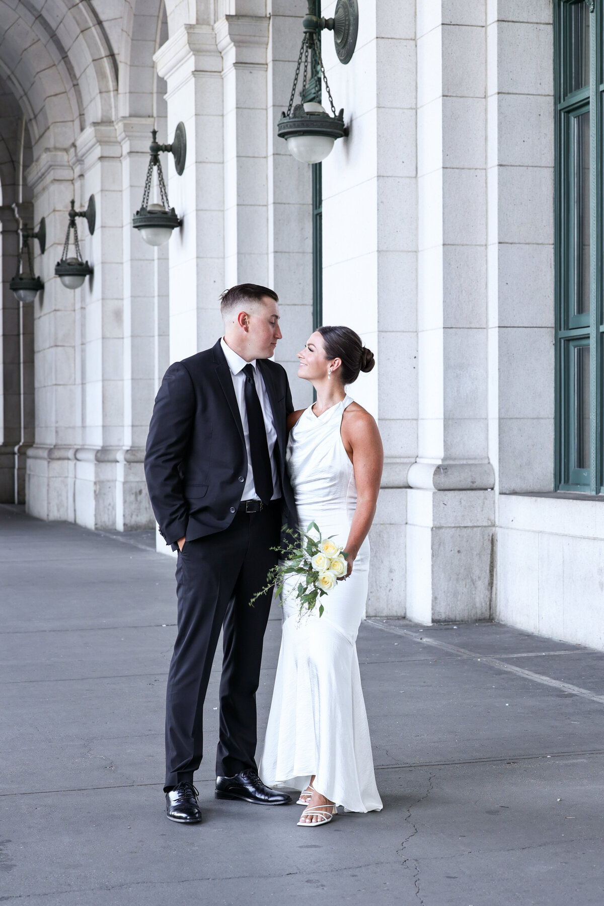 bride and groom smiling at each other during their elopement at Union Station in Washington DC by DC elopement photographer Amanda Richardson Photography