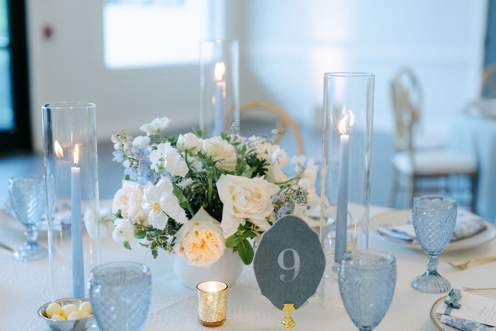 light blue, white flowers, garden arrangement, taper candles 