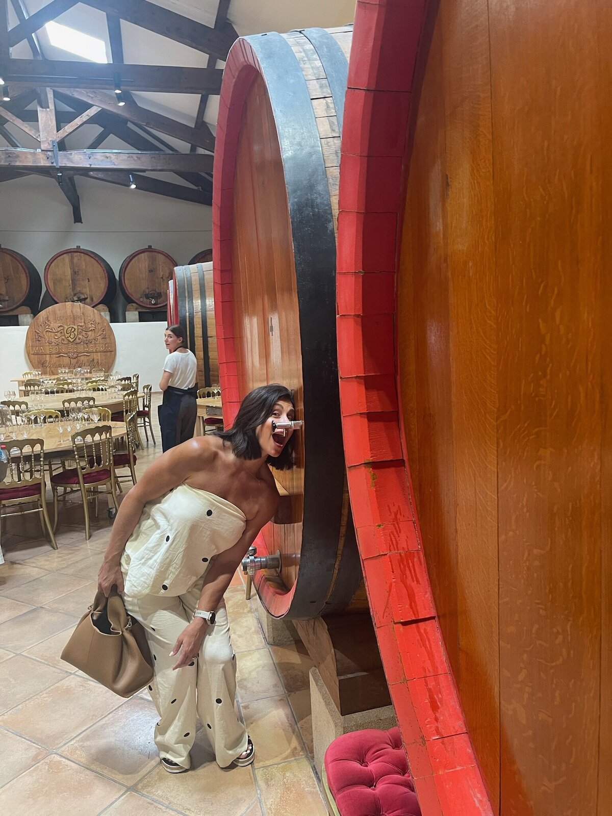 scotta drinking from wine barrel