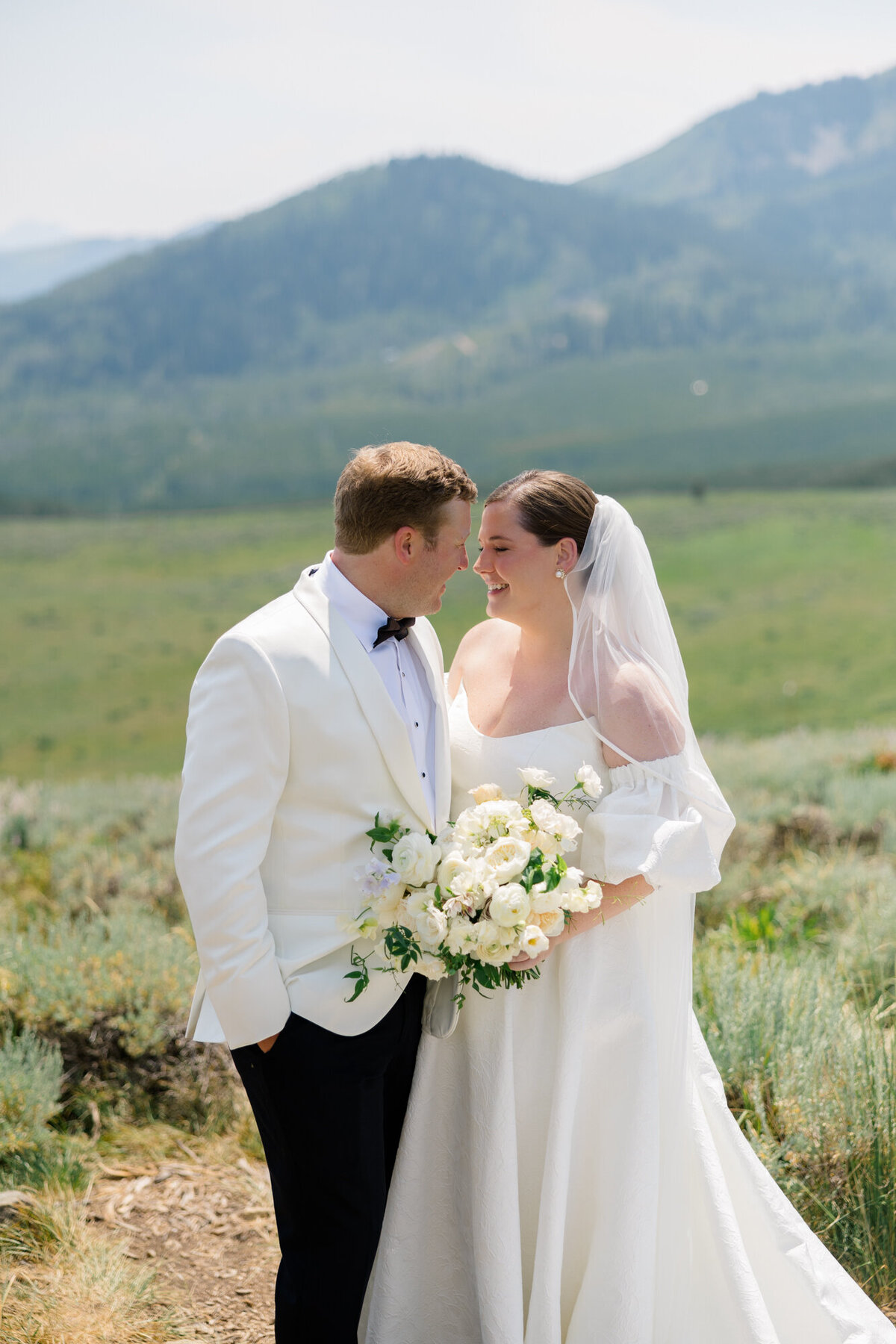 couple looking at each other on a mountain