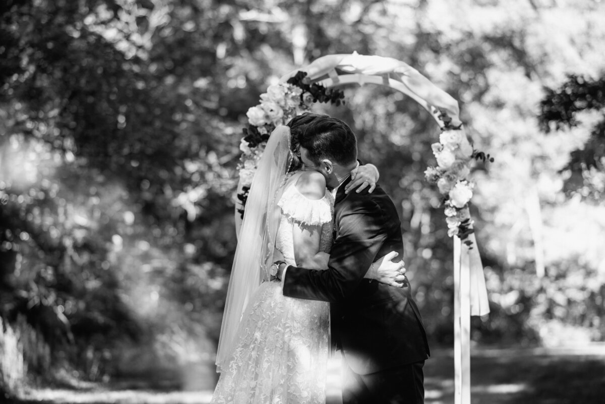 brantford ontario wedding bride and groom hug at outdoor ceremomy