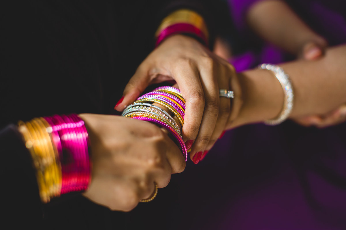 putting indian wedding bangles on