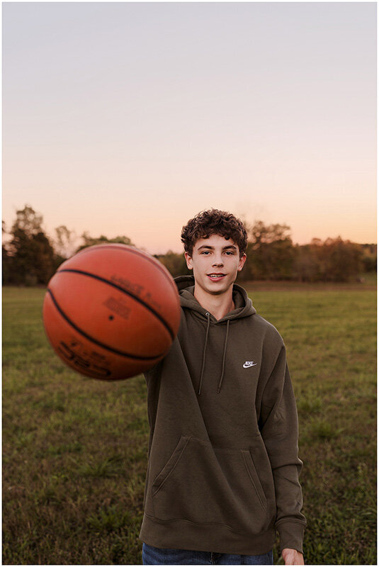 High school senior boy with his basketball