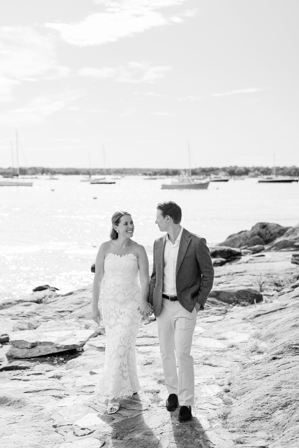 black and white portraits of couple by the water at at sunset at American Yacht Club in Rye, NY 