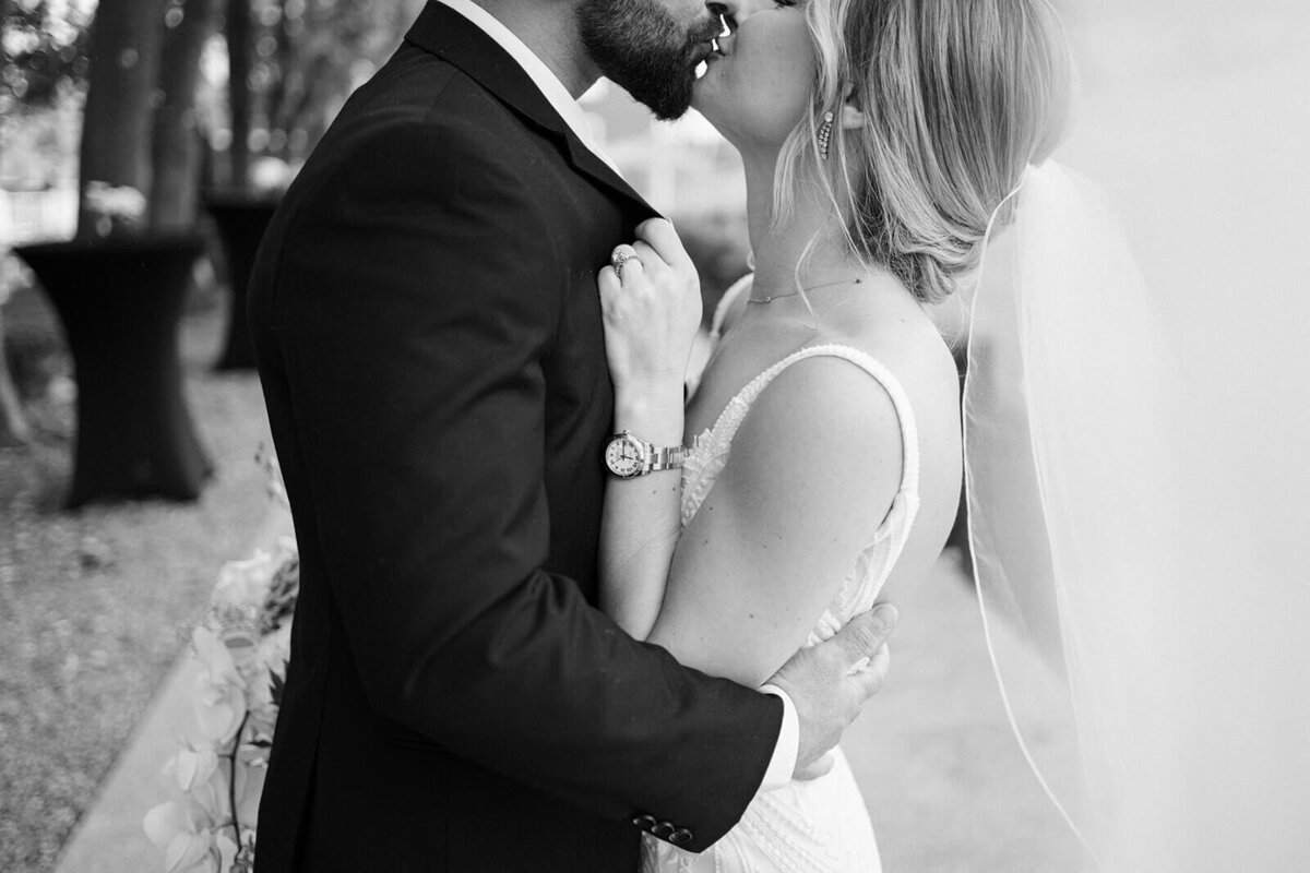 Bride and groom kissing at Finger Lakes wedding, New York