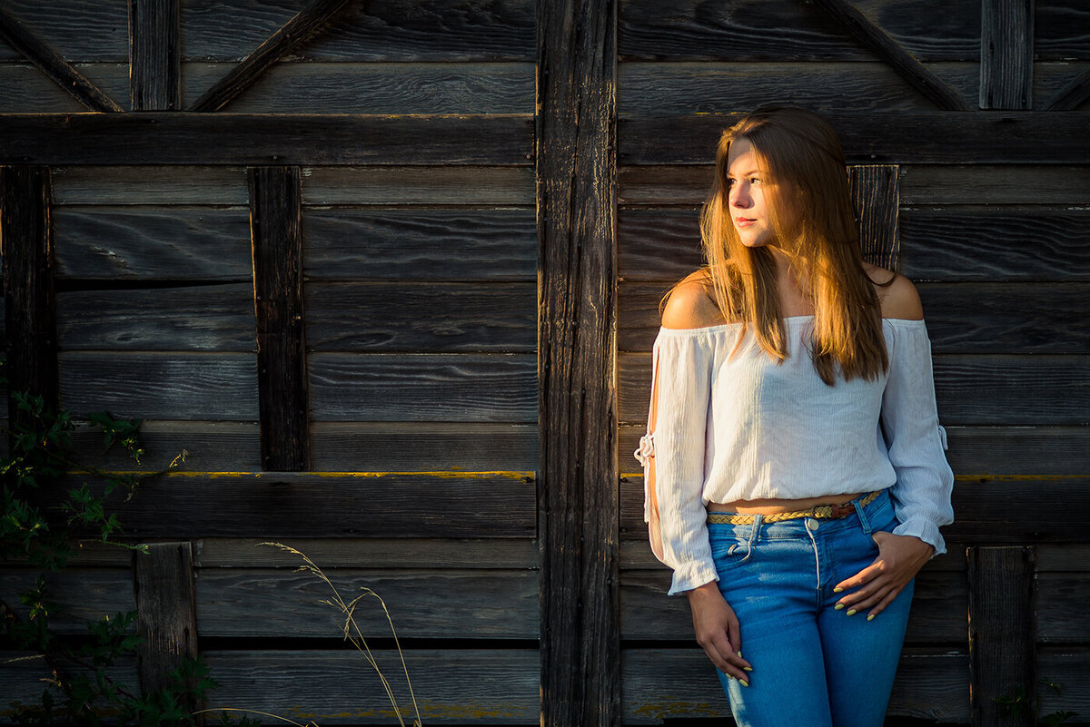 senior girl with sun on face