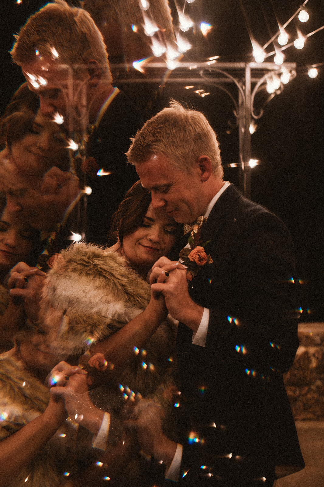 tinkle lights surround couple during first dance