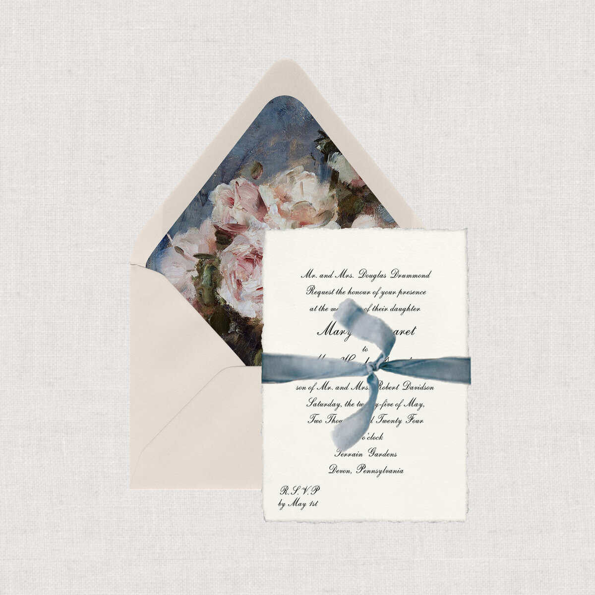 Vintage 1940 wedding invitation suite tied with dusty blue ribbon.