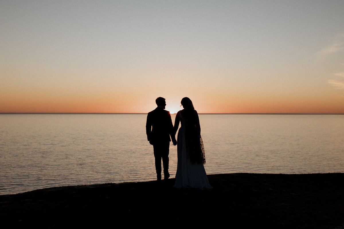 Romantic outdoor wedding moment of bride and groom kissing, photographed by JakeyVass Media.