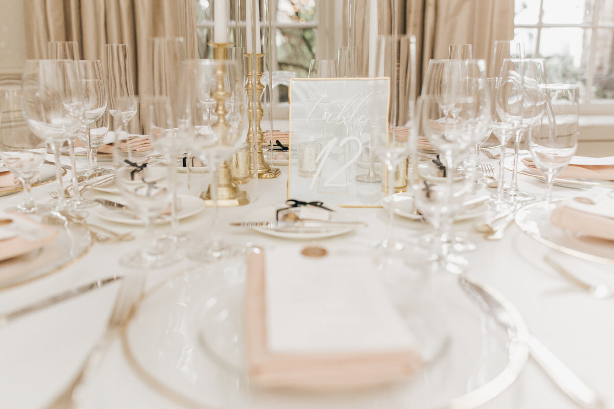 Chic glass table number at glamorous wedding dinner