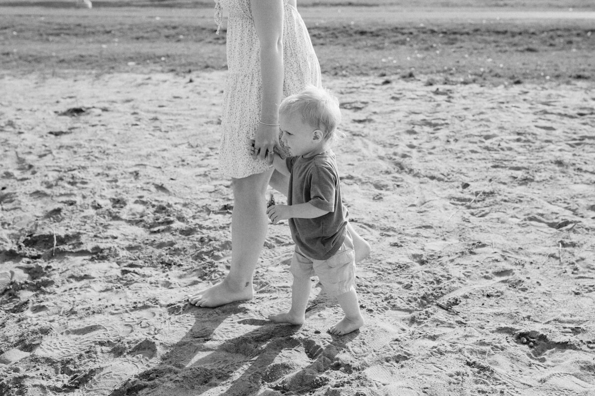 mother and son walking at sunset family beach session