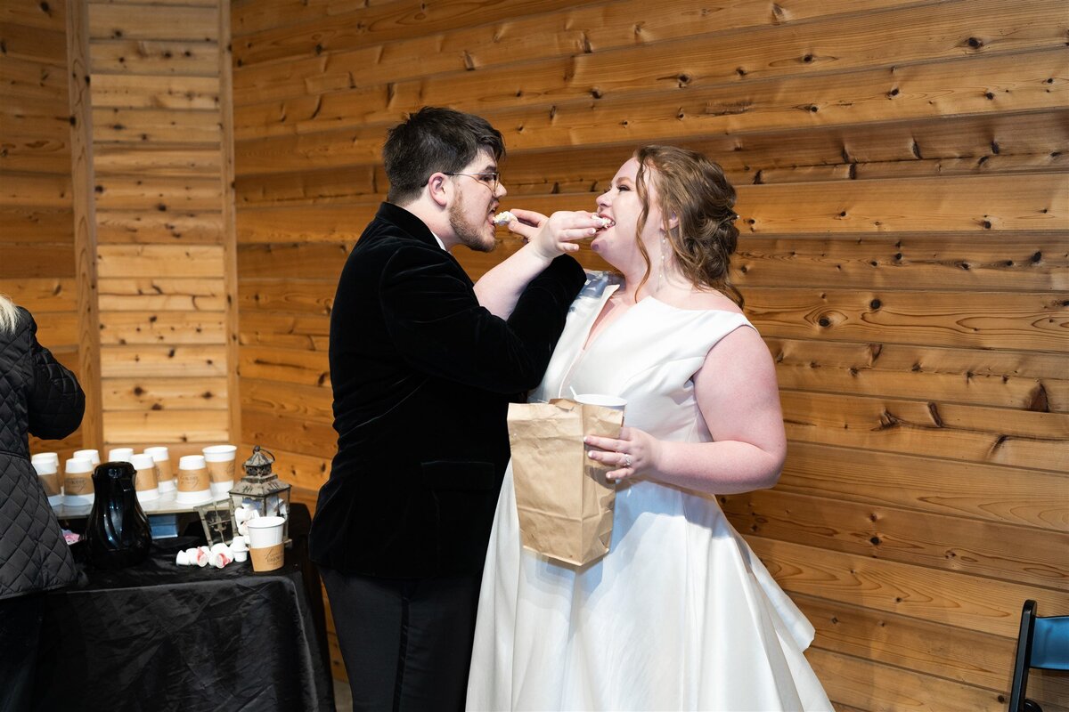 Bride and groom share a treat on their wedding day.