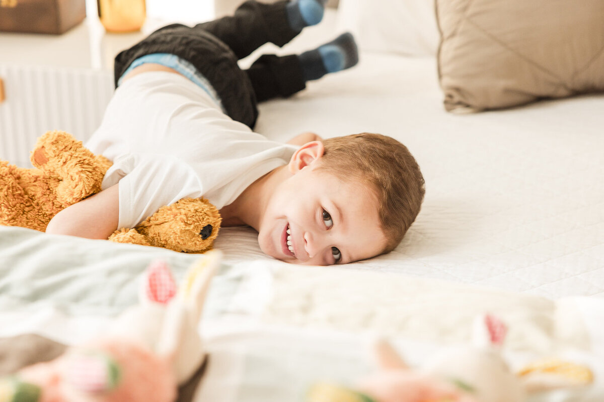 In-home lifestyle family session with mom, dad, toddler, and newborn in Orlando Florida home

