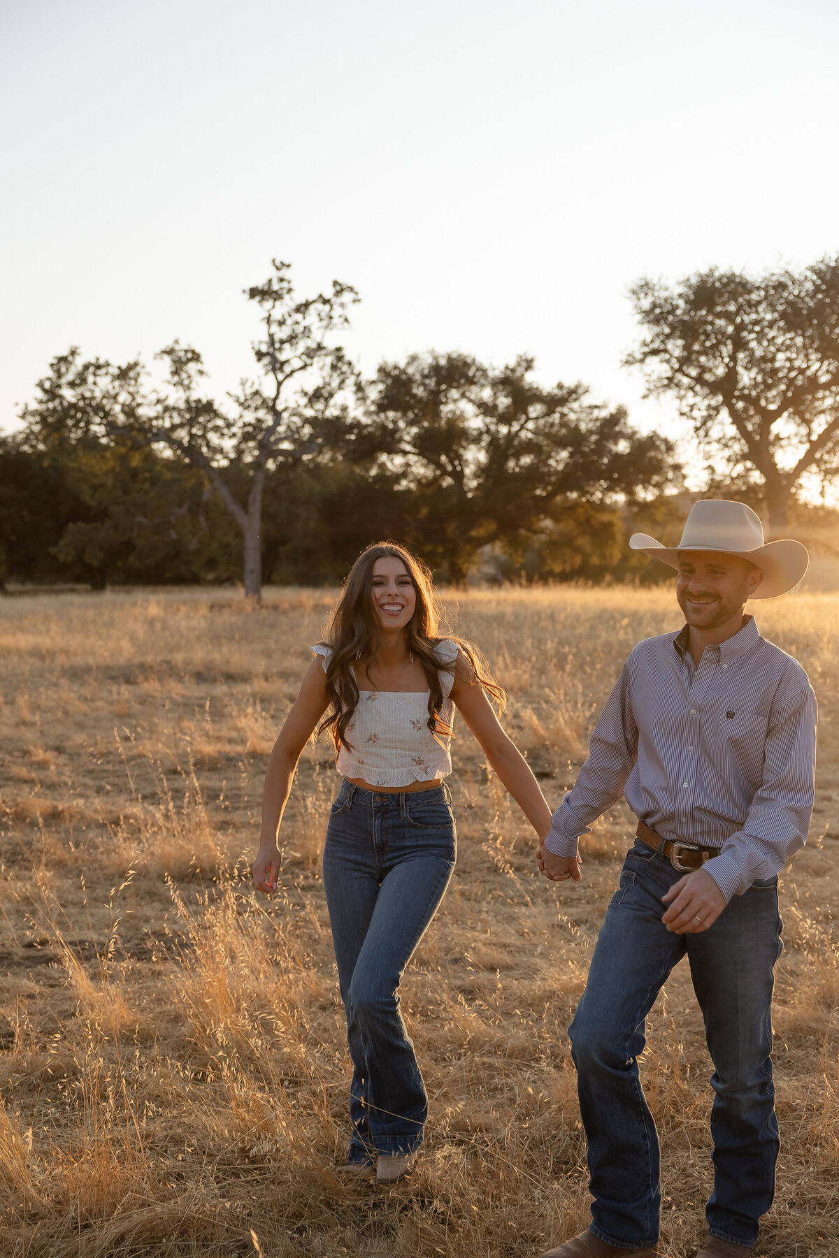 couples engagement photos golden hour field candid in San Luis Obispo on the Central Coast