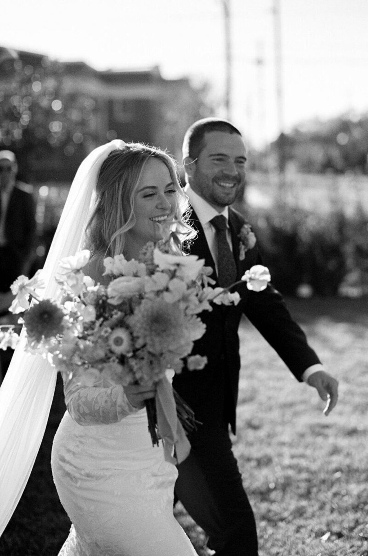 orlando wedding photography of bride and groom holding floral bouquet, by Marissa Nicole
