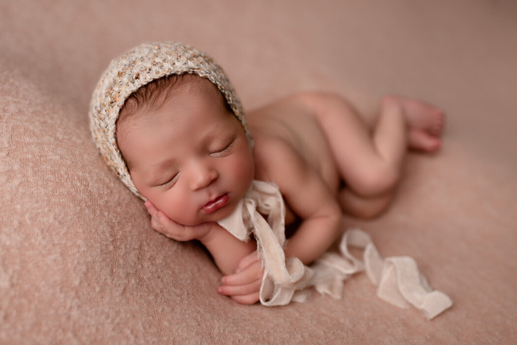 Brighton Newborn Photographer baby with bonnet by For The Love Of Photography