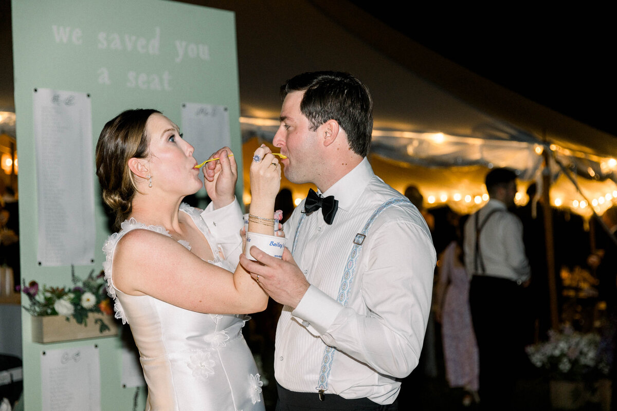 bride and groom eating ice cream