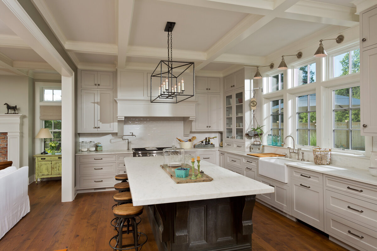 white kitchen with dark accent island