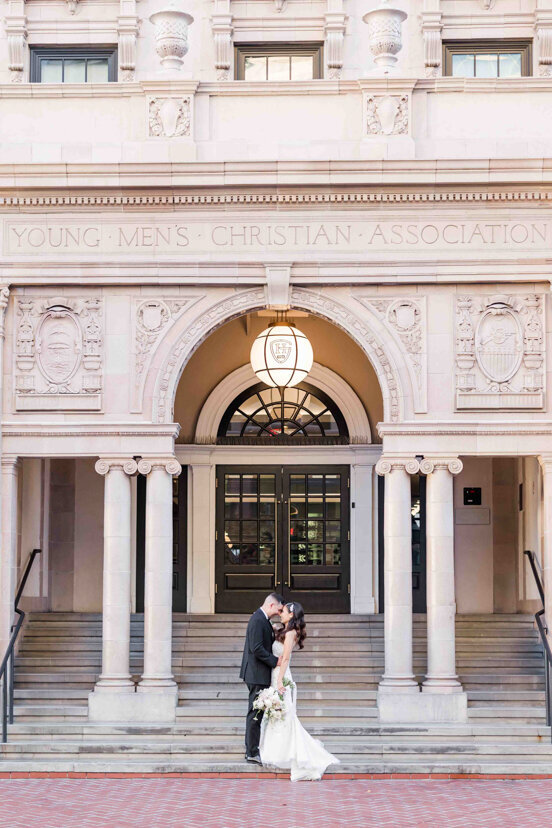bride-and-groom-on-front-steps-of-the-guild-hotel-san-diego