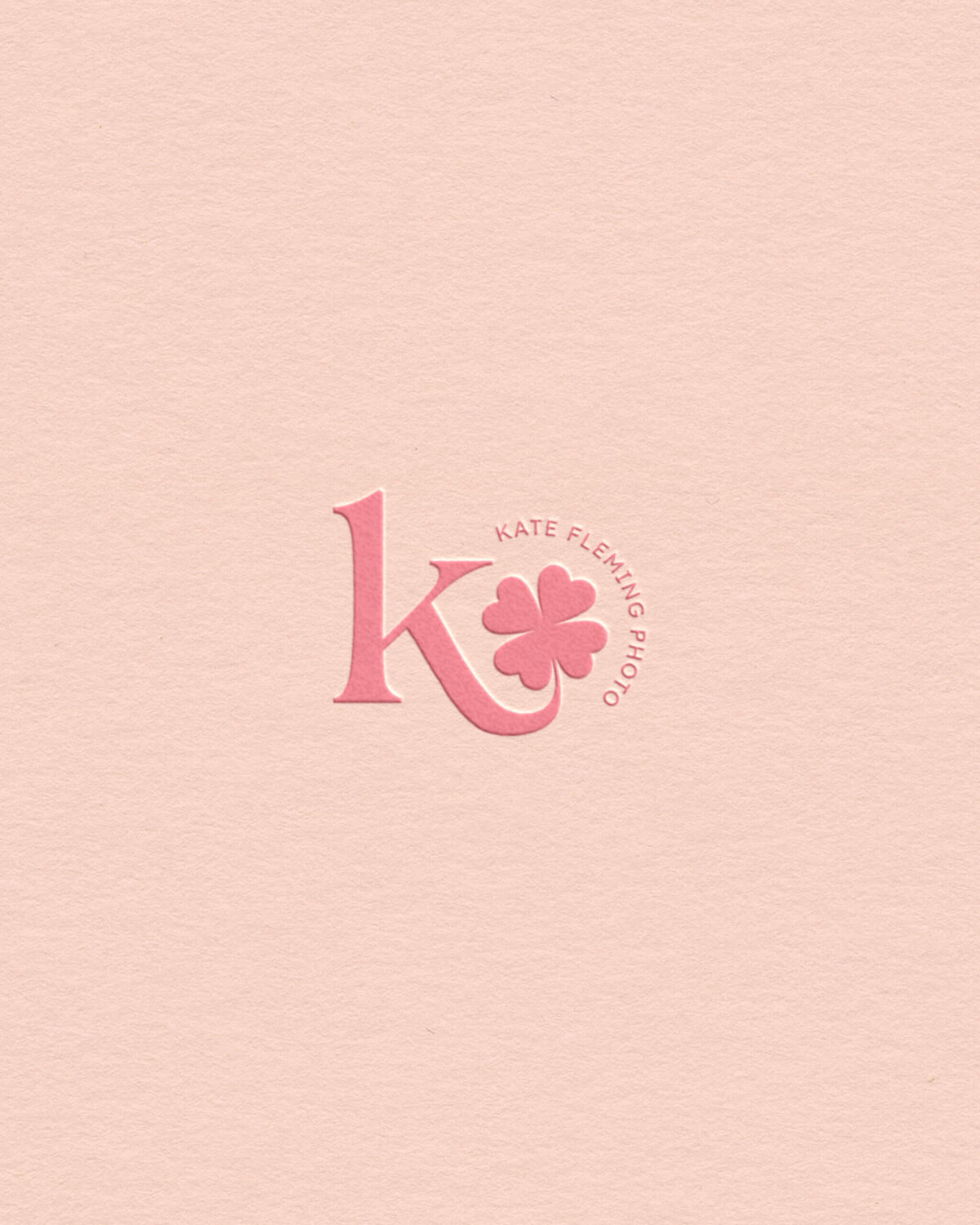 photography studio logo with a whimsical four-leaf clover illustration, symbolizing joy and good fortune