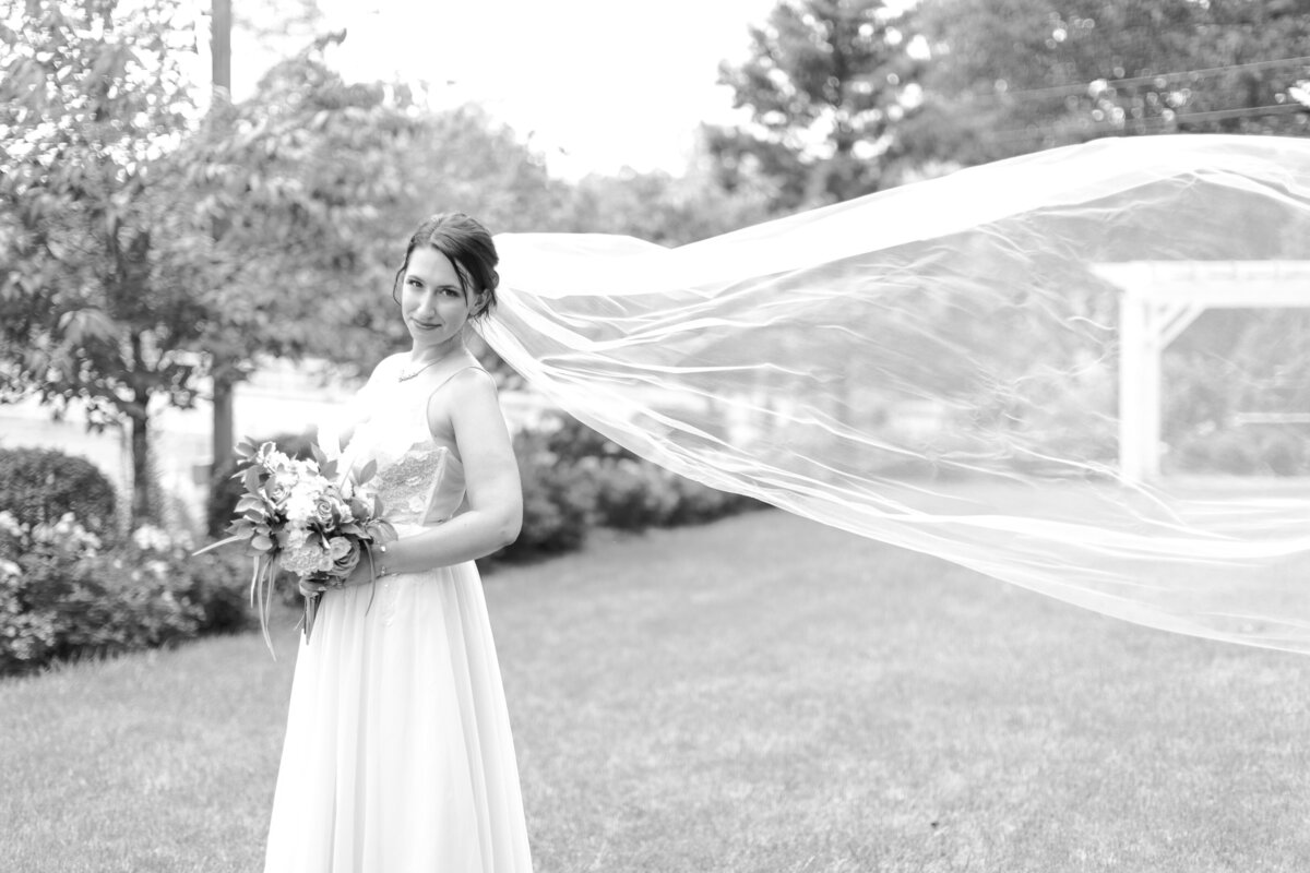 bride with flying veil in black and white