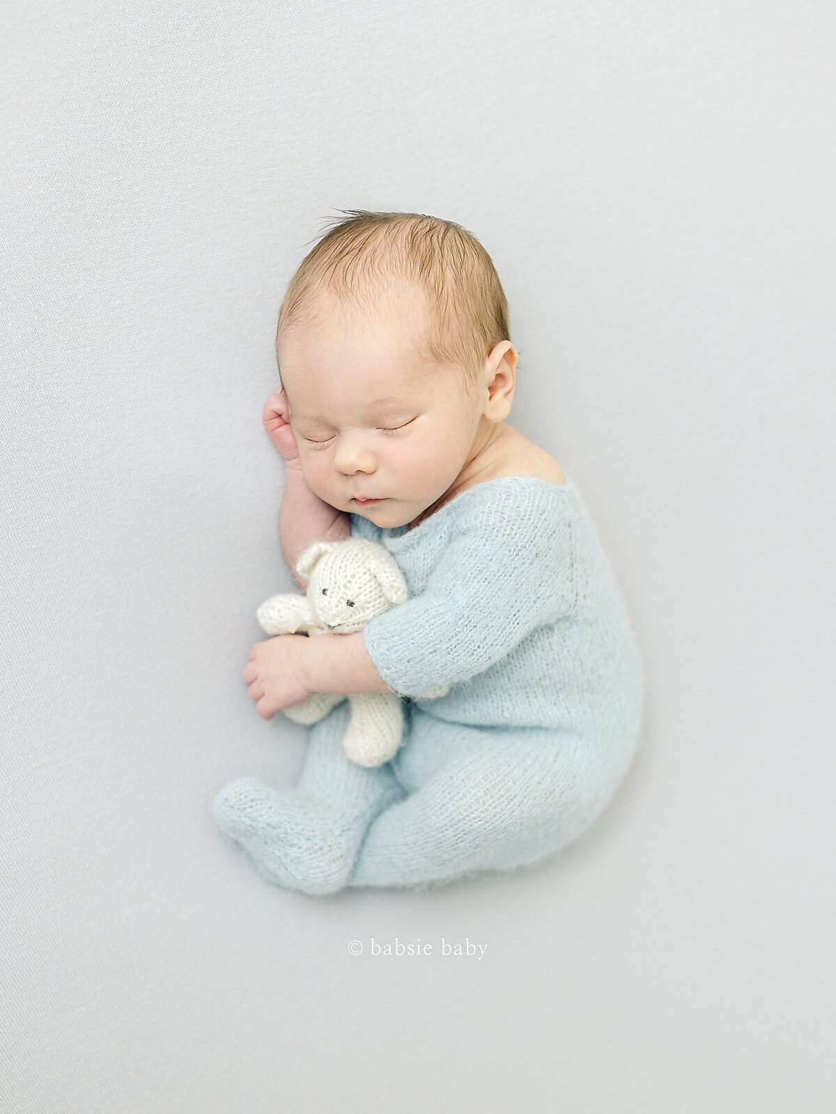 light-and-airy-newborn-photographer-in-san-diego-baby-blue-outfit