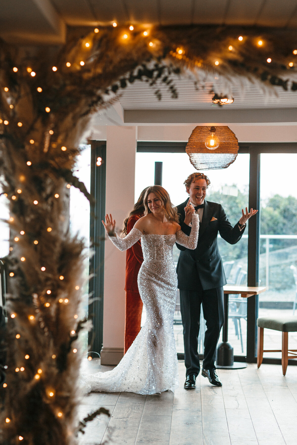 Couple exit the aisle in style at winter wedding at Gara Rock 
