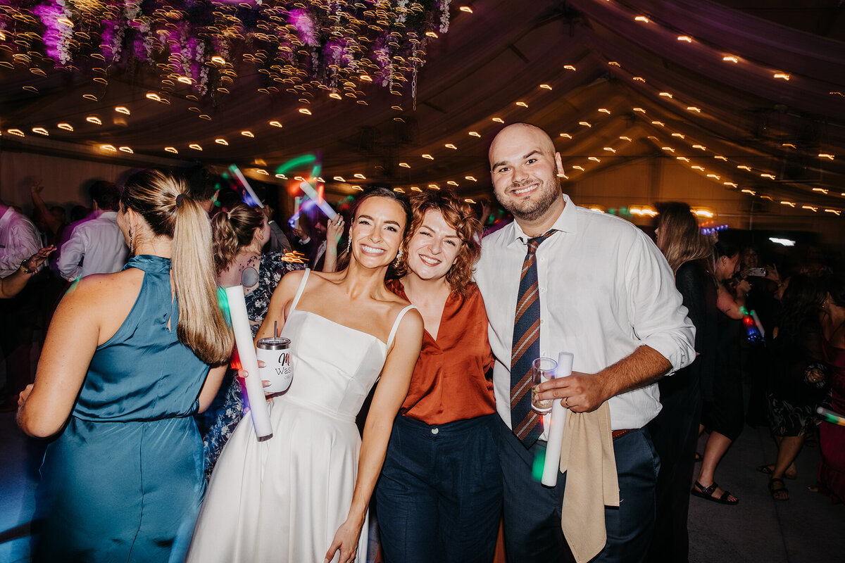 kelly-kaz-photographer-with-client-bride-groom-at-reception-disco