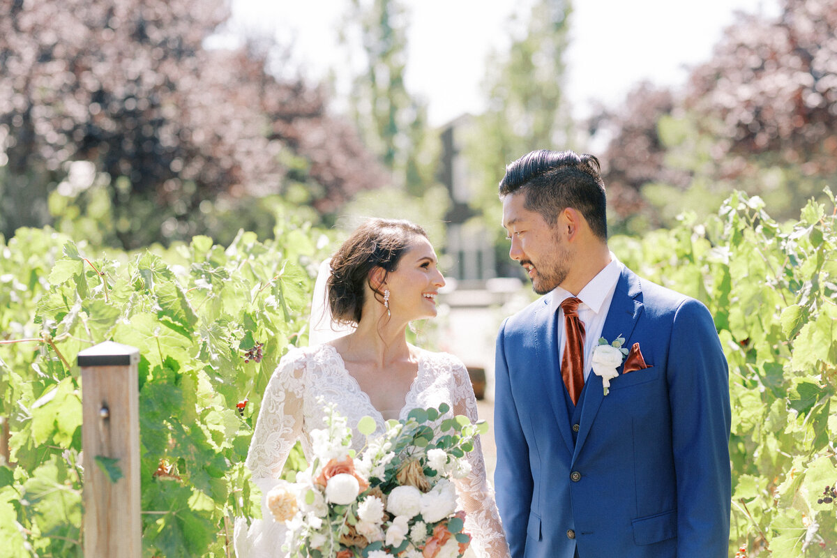 bride and groom looking at each other