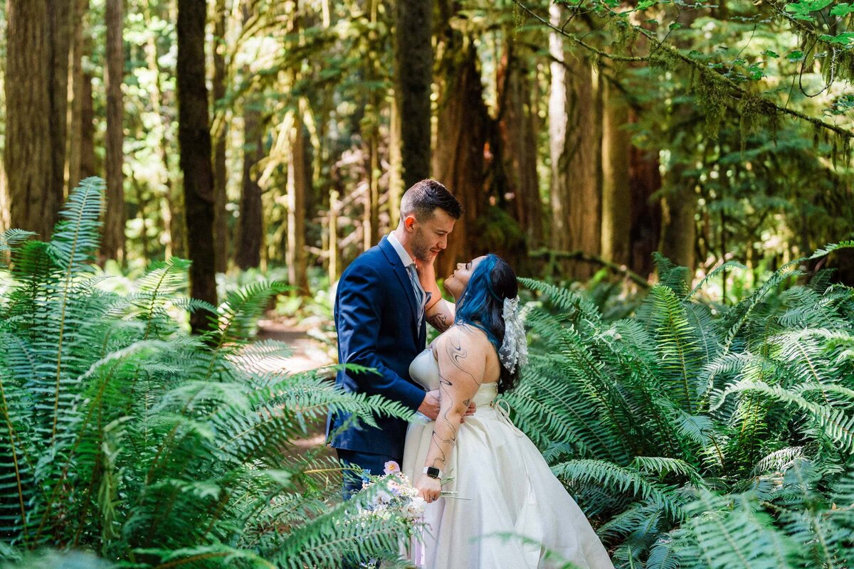 An eloping couple lusting after each other amidst the ferns of Washington state.