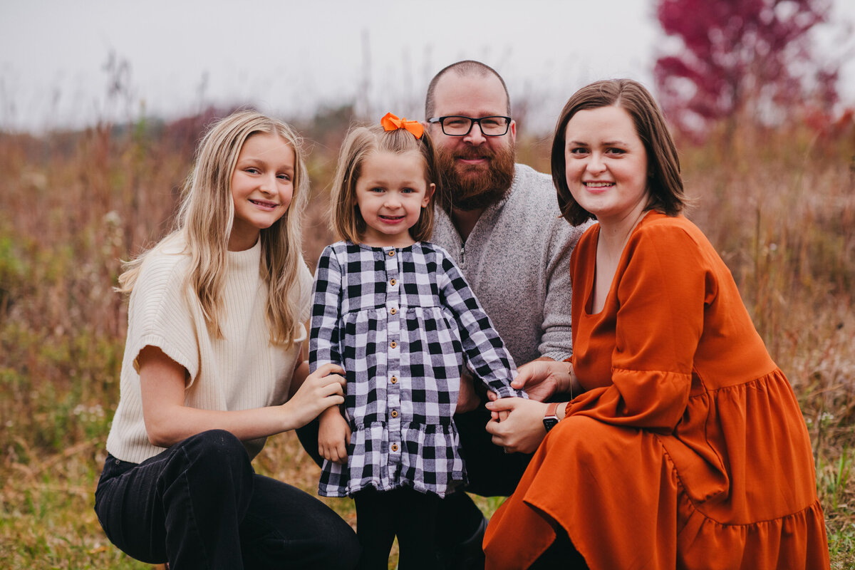 a family poses during a photo shoot in crossville
