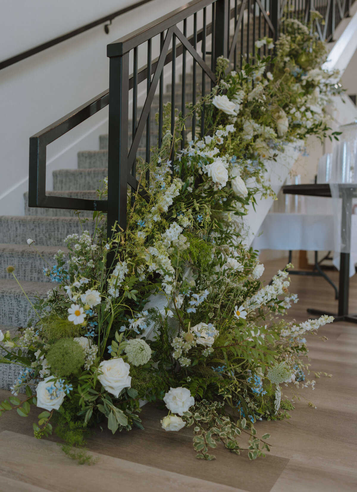 lush staircase wedding entrance flowers
