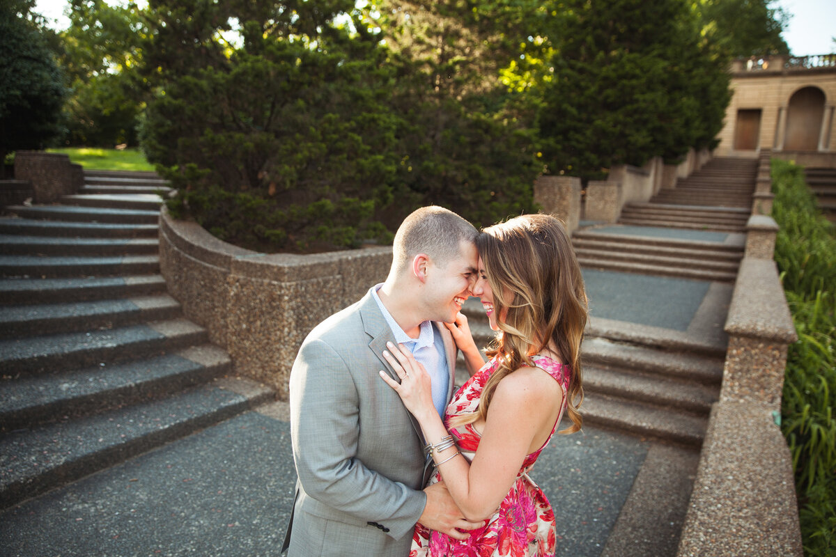 A couple goes in for a kiss at Meridian Hill.