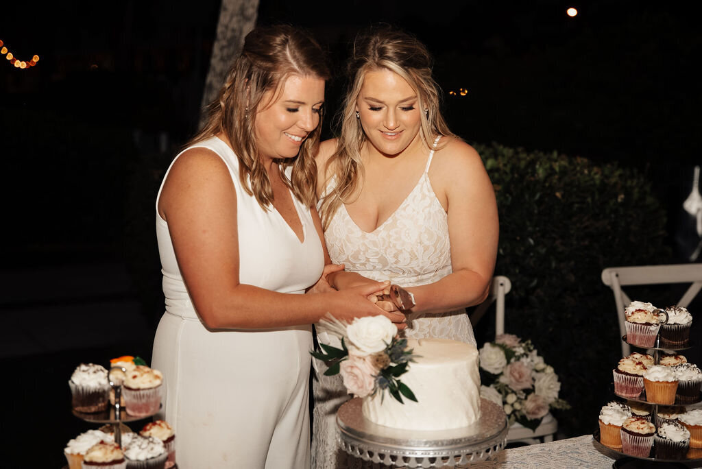 27 - Postcard Inn LGBTQ Destination Beach Wedding Cake Cutting - Tampa Bay Wedding Planner