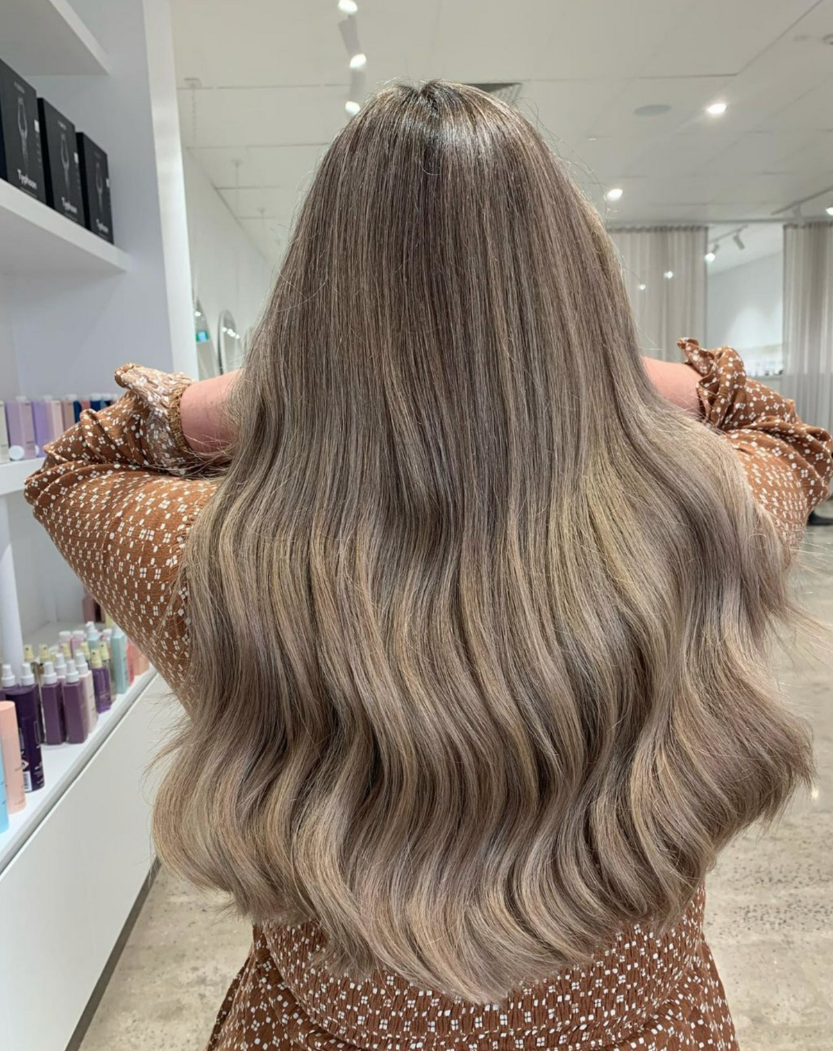 Woman with freshly coloured hair - brunette with blonde foils