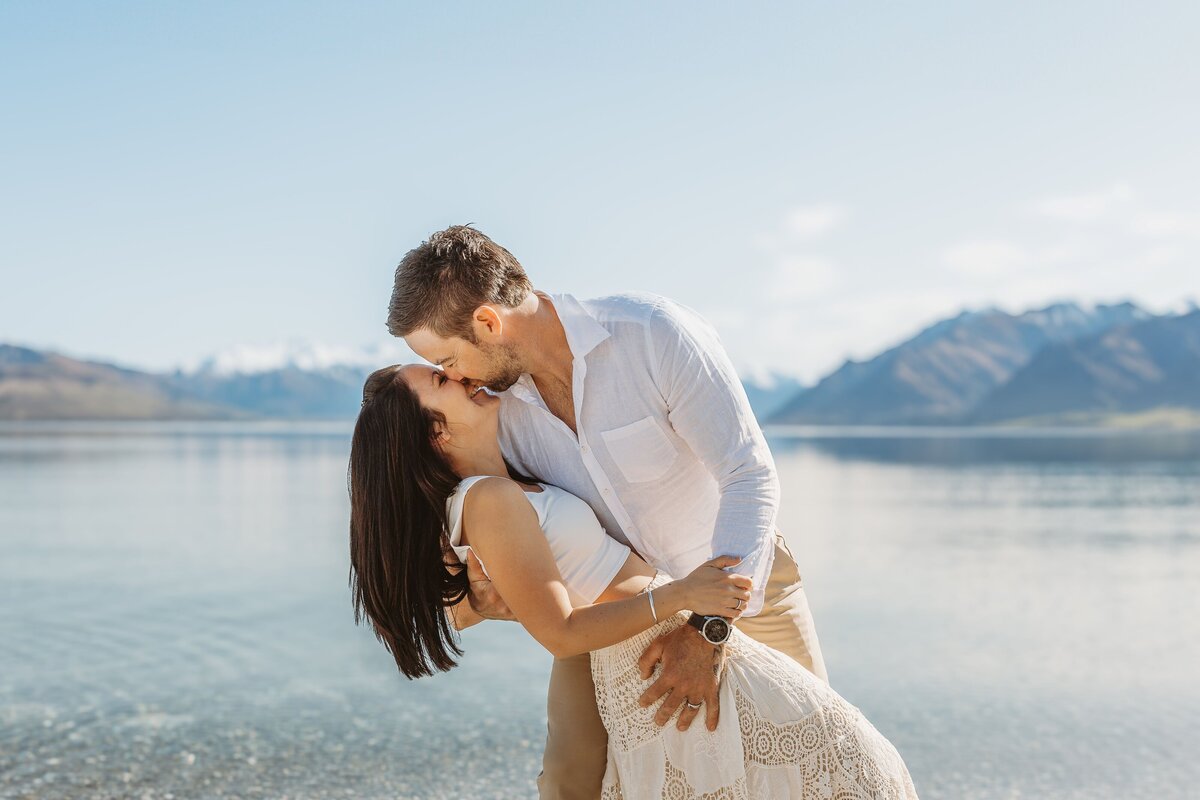 couple kissing during their engagement session in wanaka with Captured by Bie