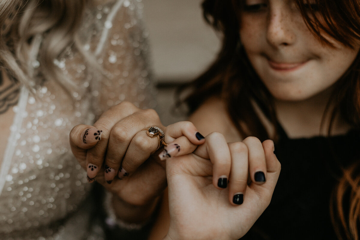bride and step daughter pinky promising