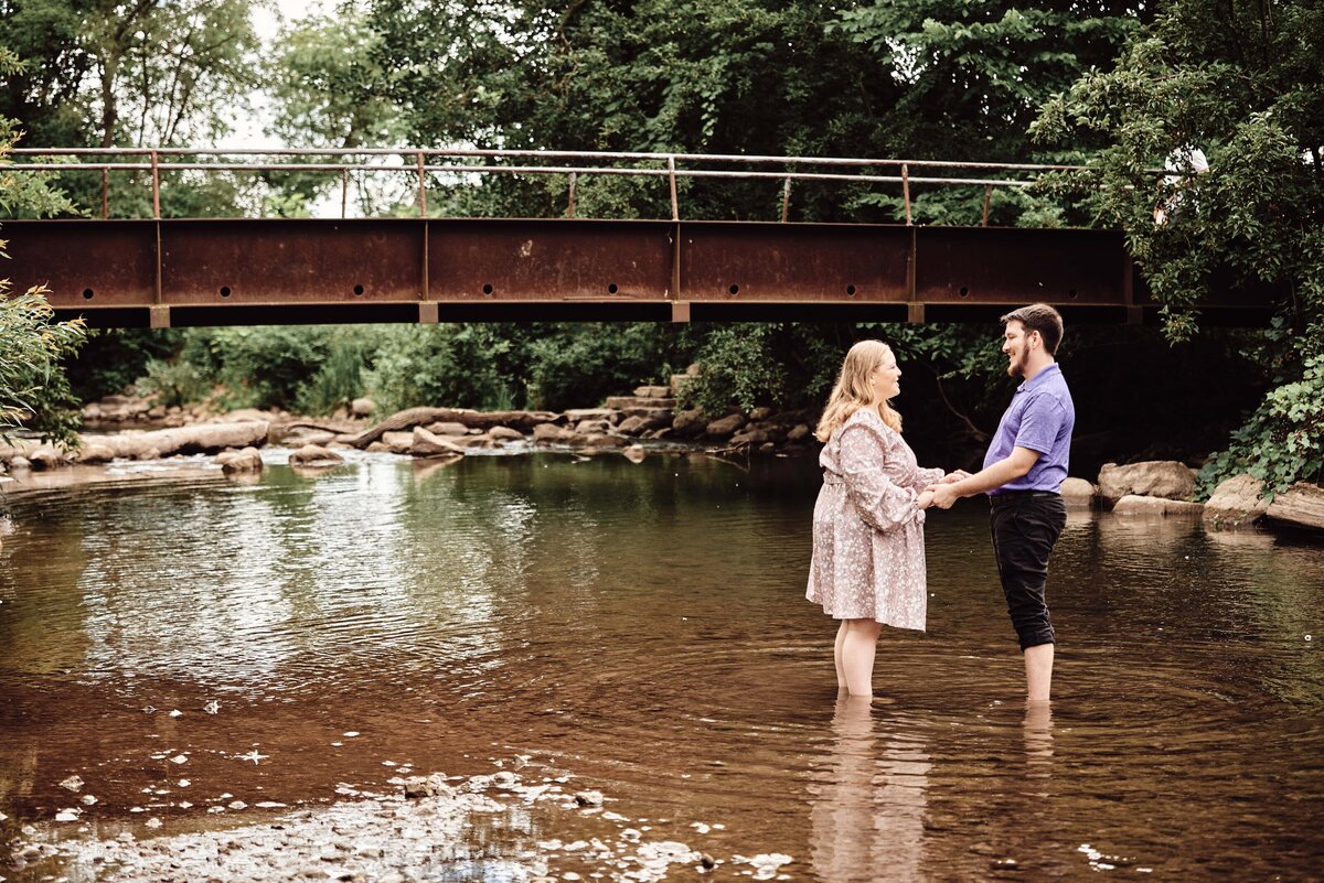 Couple in Creek Engagement Photos