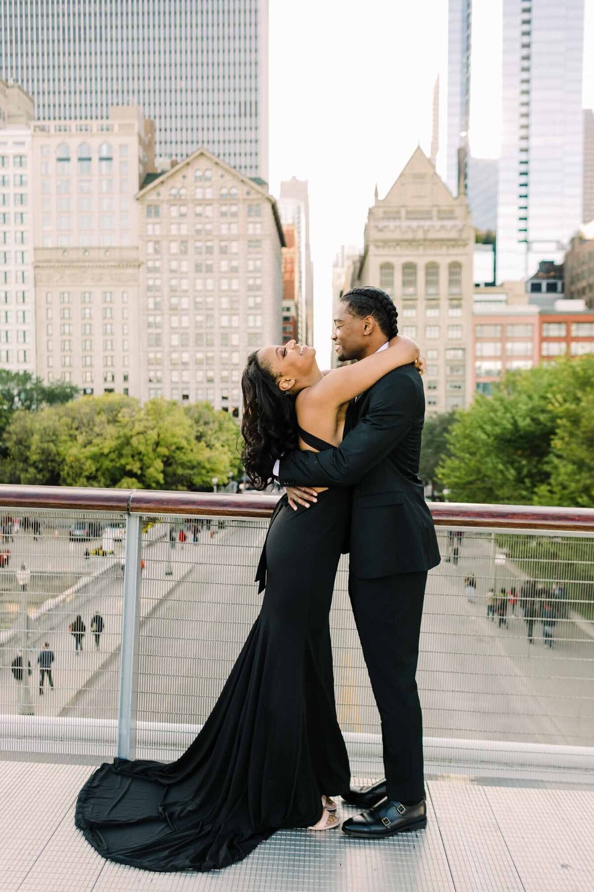 African American couple pose for engagement photo on the Nichols Bridgeway in downtown Chicago