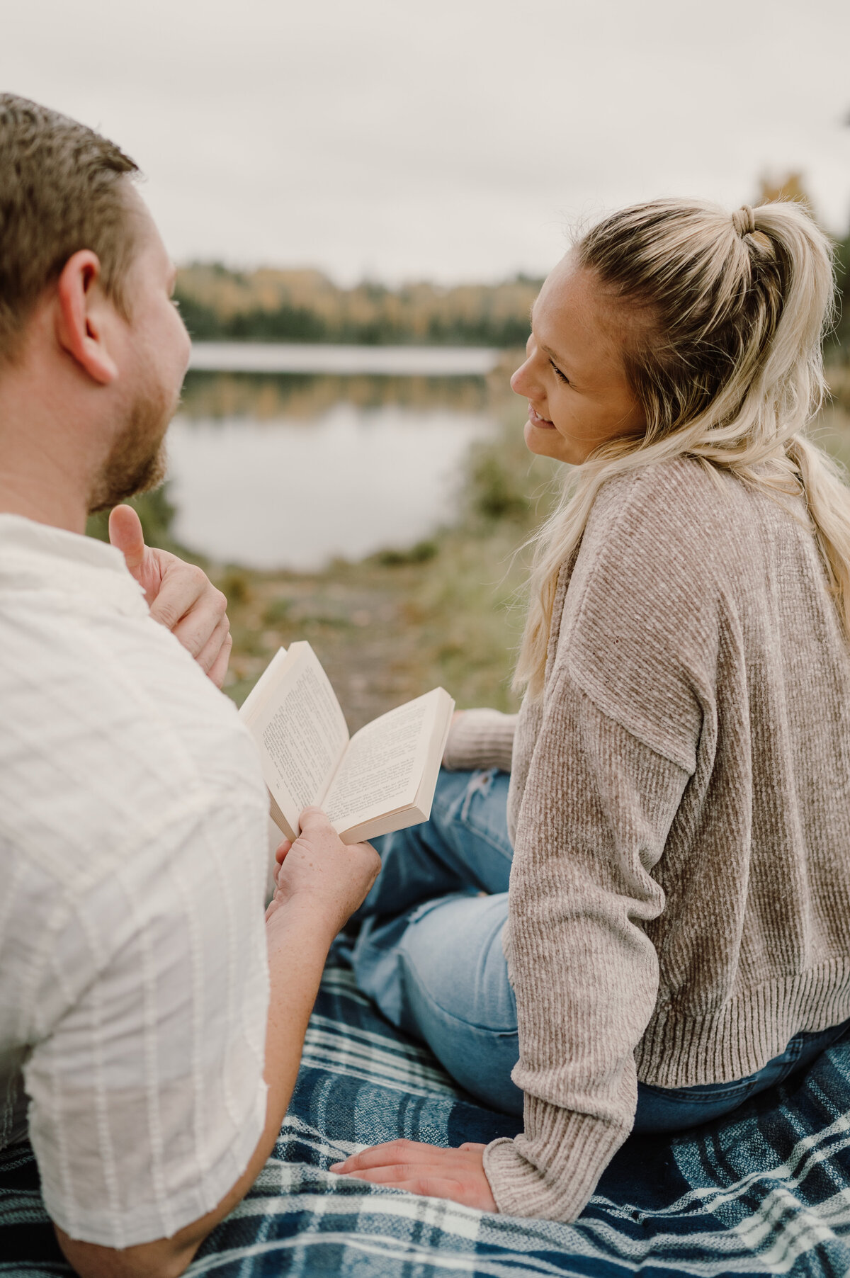 boy read a book to a girl