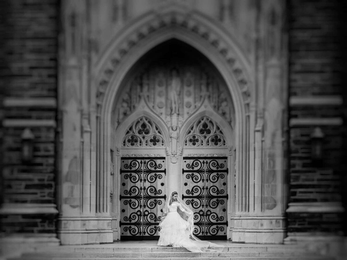 A bride standing in front of a grand doorway