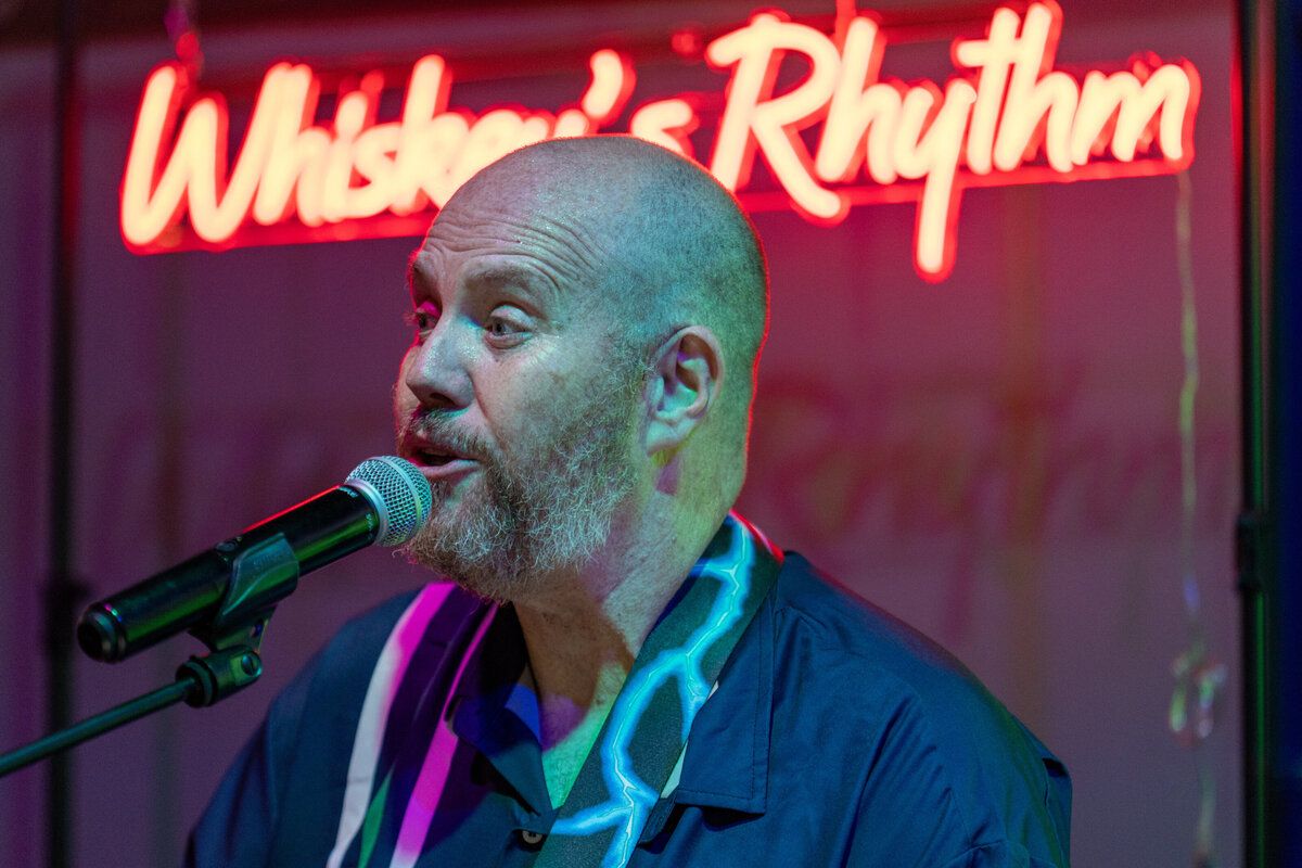 A person singing into a microphone 